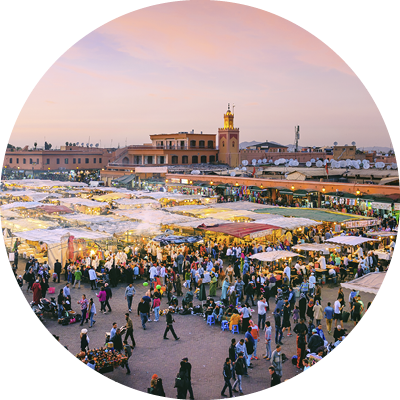 Famous Djemaa El Fna Square in early evening light, Marrakech, Morocco with the Koutoubia Mosque, Northern Africa.Nikon D3x