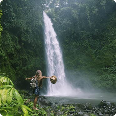 Woman near Nung Nung waterfal on Bali, Indonesia