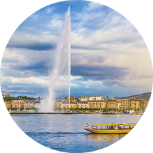 Beautiful view of Geneva skyline with famous Jet d'Eau fountain at harbor district in beautiful evening light, Switzerland.