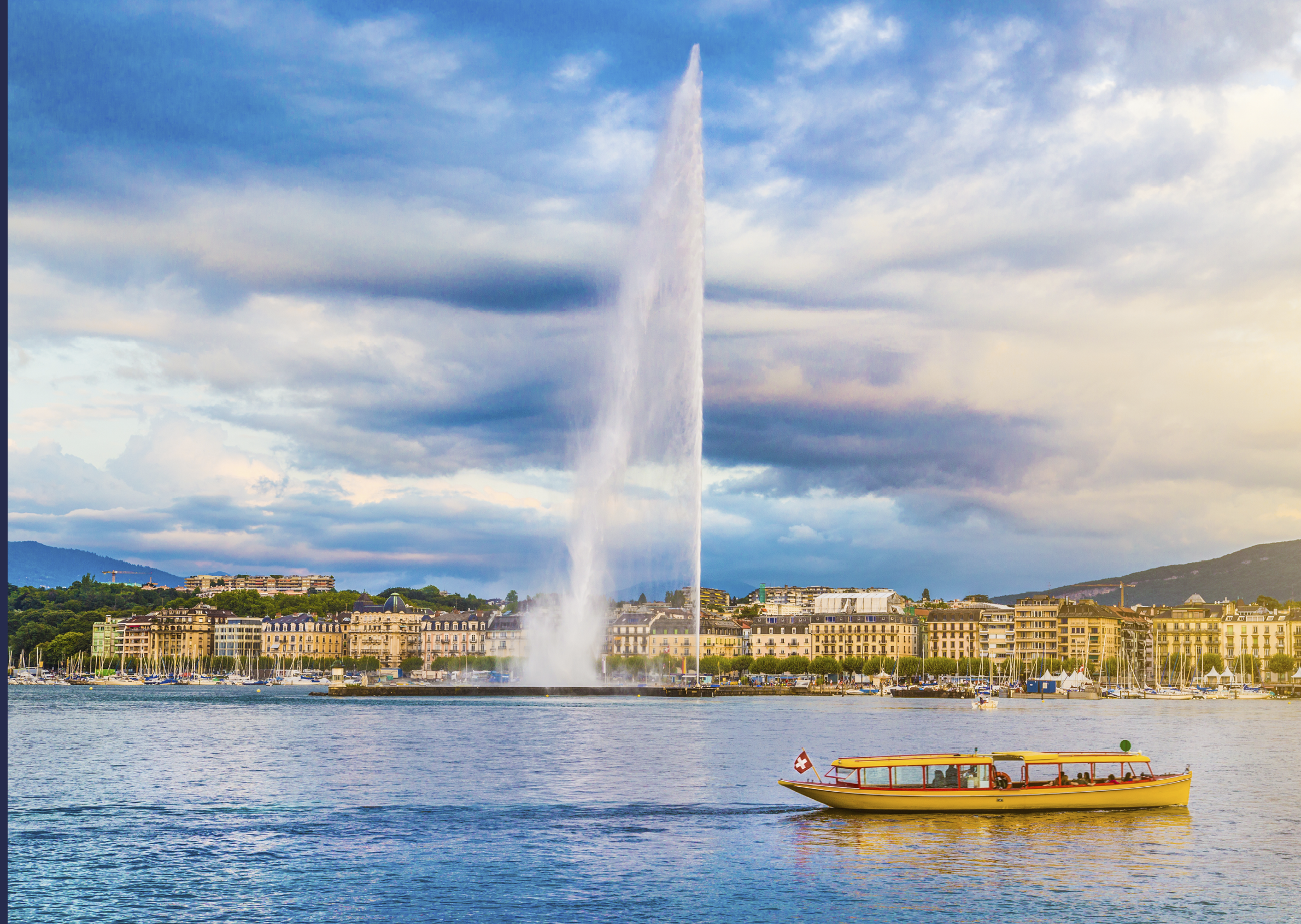 Beautiful view of Geneva skyline with famous Jet d'Eau fountain at harbor district in beautiful evening light, Switzerland.