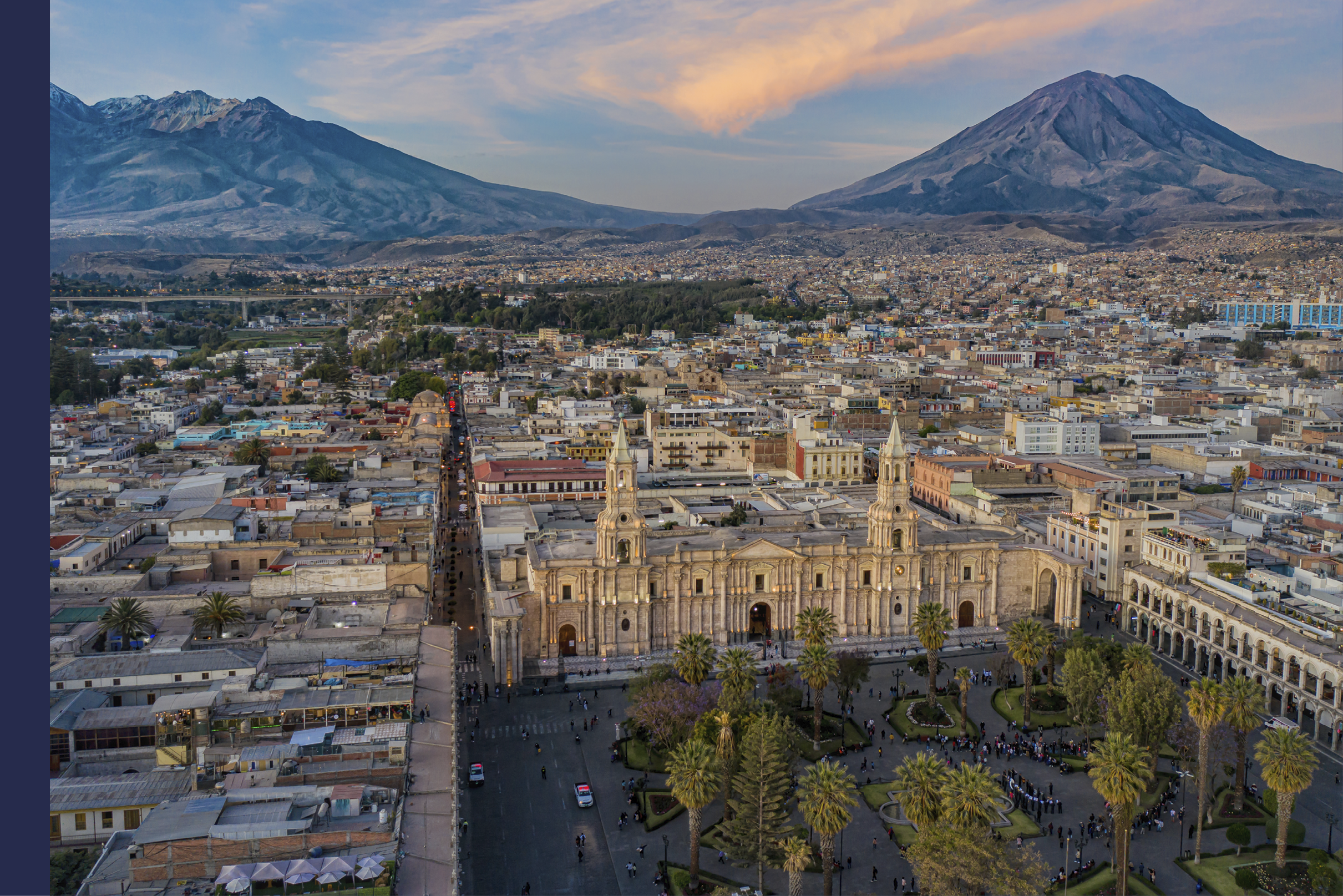 Drone shot of the Plaza de Armas with the Arequipa Cathedral and the Misti Volcano in the background in Peru at the blue hour/sunset