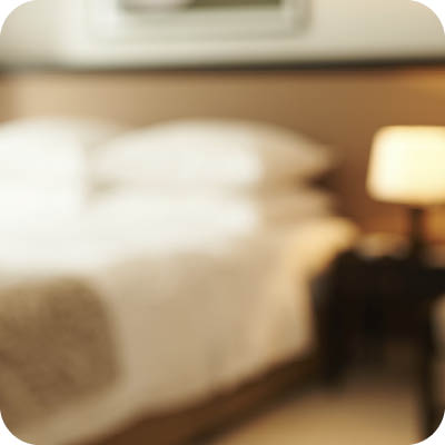 Opened door of hotel room with key in the lock