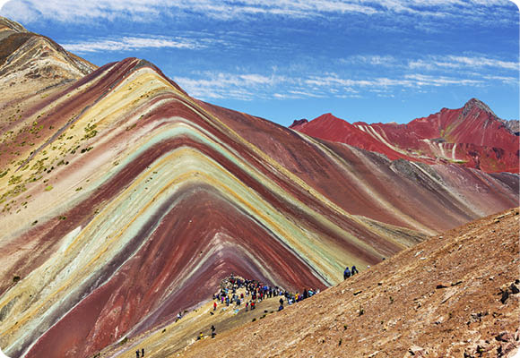 Rainbow mountain or Vinicunca Montana de Siete Colores and beautiful sky, Cuzco or Cusco region in Peru, Peruvian Andes mountains, panoramic view