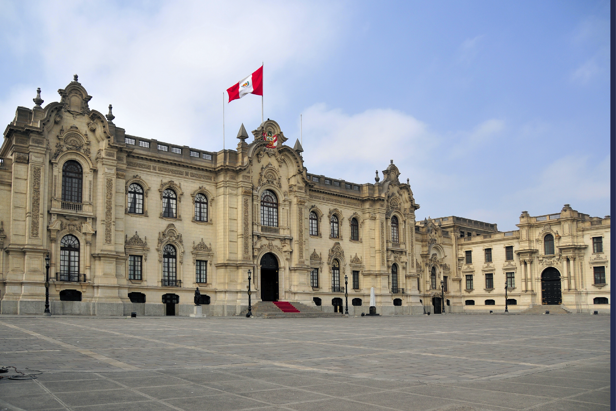 Lima, Peru: Government Palace - Residence of the President - known as House of Pizarro - Palacio de Gobierno - Plaza de Armas - Historic Centre of Lima, Unesco World Heritage Site, sky, copy space - photo by M.Torres
