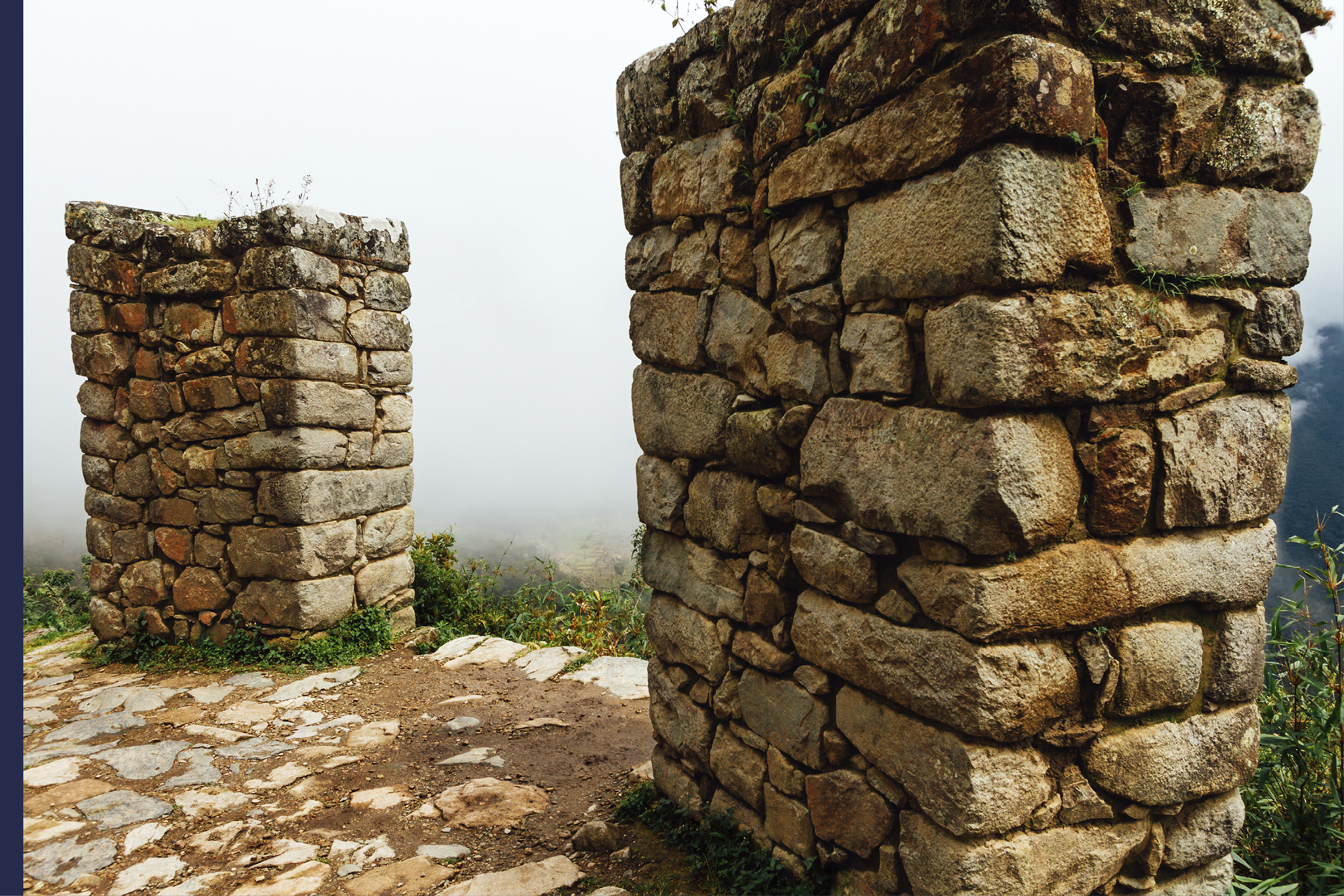 Walls of Sun Gate (Intipunku) in Machu Picchu with haze